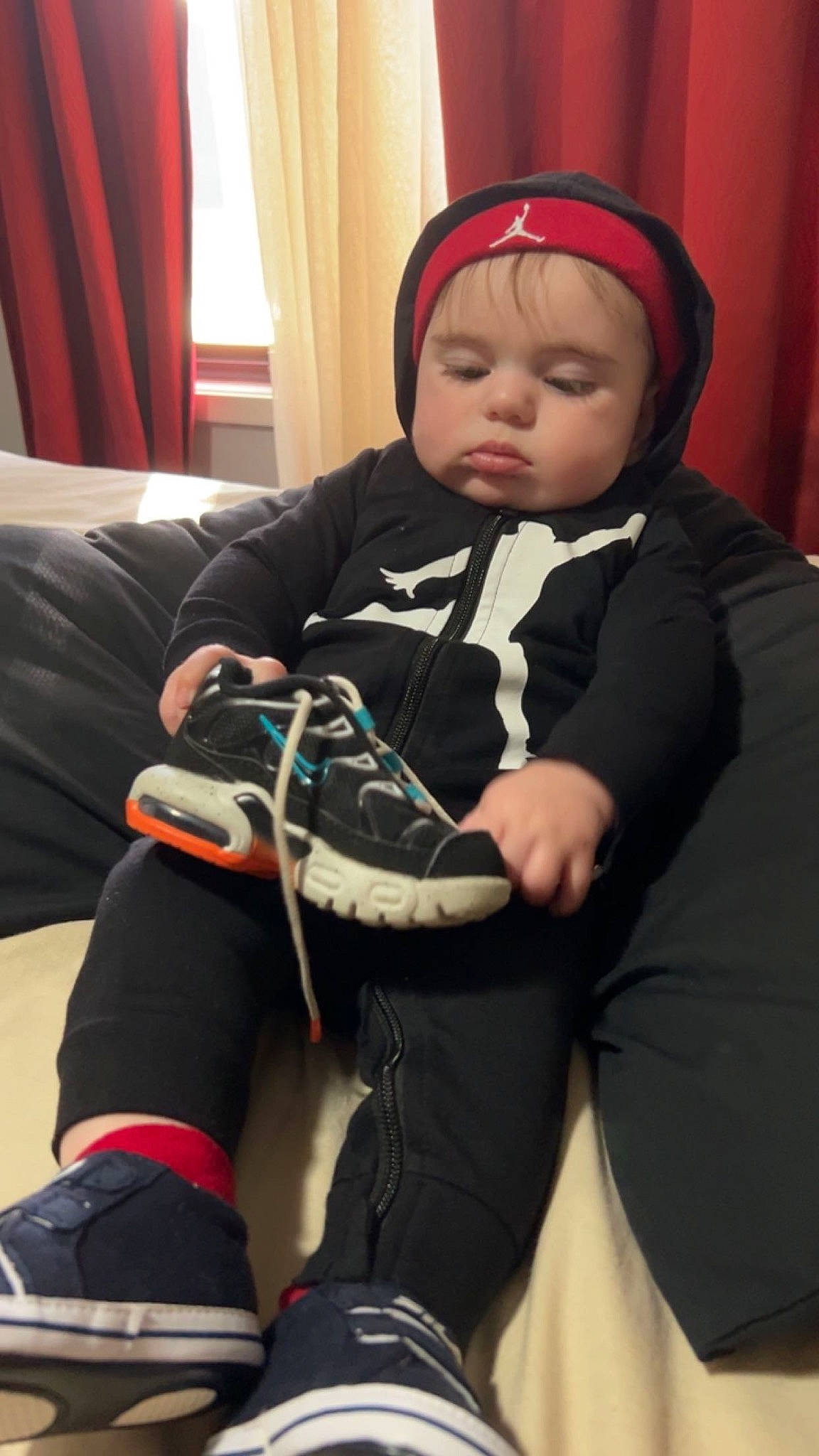 Frederick joined the competition — help win amazing prizes! baby, baby_toddler_clothing, cap, child, comfort, curtain, elbow, event, face, fun, headwear, human_body, human_leg, knee, person, personal_protective_equipment, sitting, sleeve, sock, suit