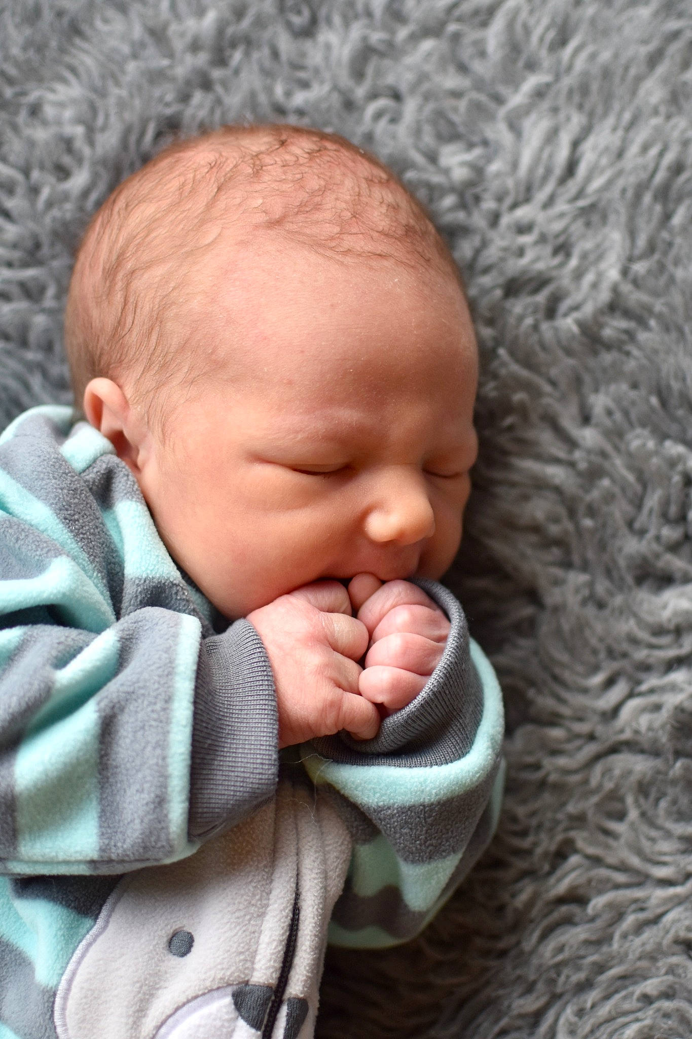 Bruce is registered to the contest to win money with this photo: baby, baby_products, baby_sleeping, baby_toddler_clothing, bedtime, cheek, child, chin, comfort, gesture, happy, linens, nail, nose, person, portrait_photography, skin, sleeve, textile, thumb
