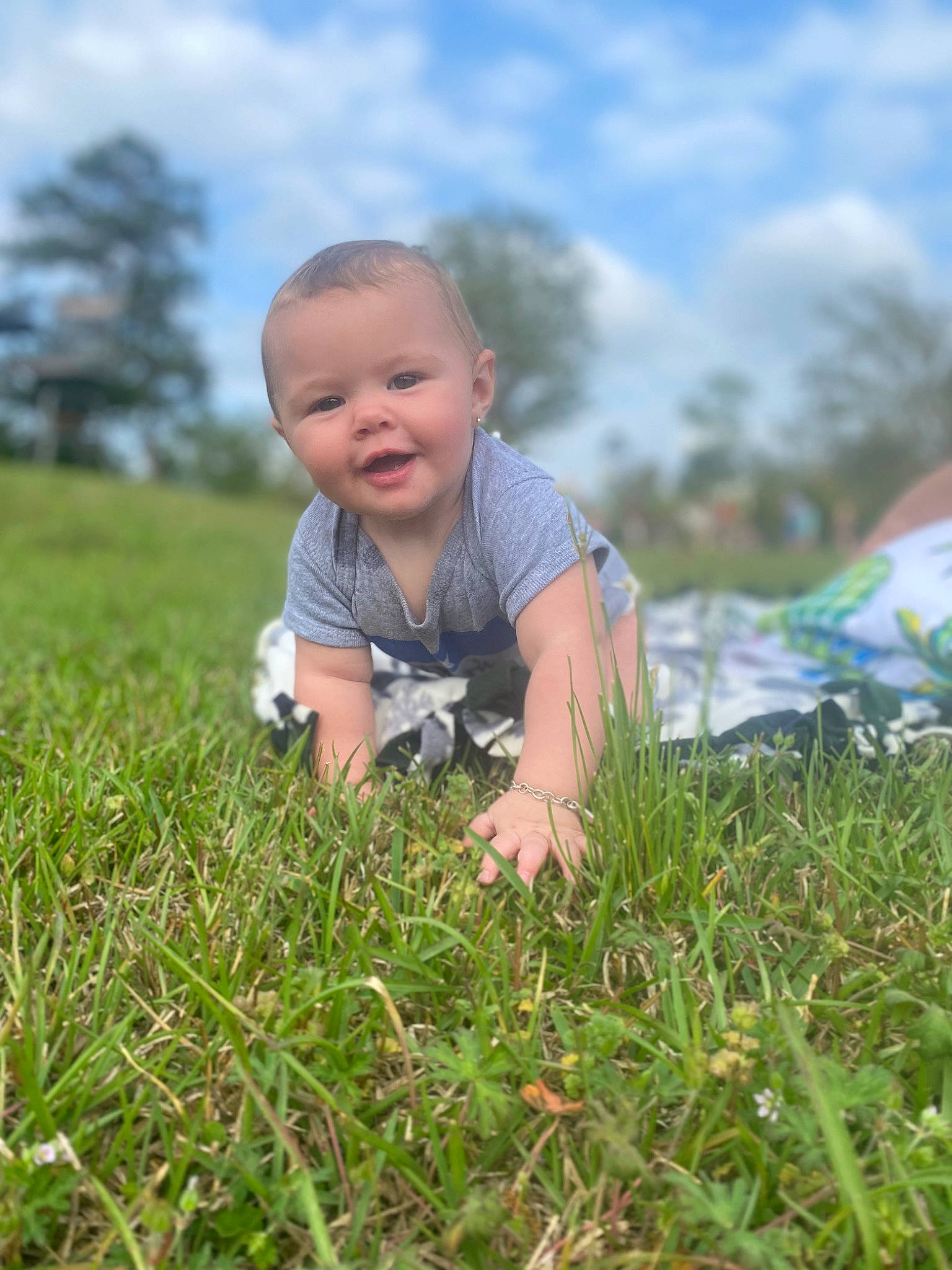 Preslee is registered to the contest to win money with this photo: baby, baby_toddler_clothing, cloud, dress, flash_photography, fun, grass, grassland, happy, leaf, people, people_in_nature, person, plant, skin, sky, smile, sunlight, tent, toddler