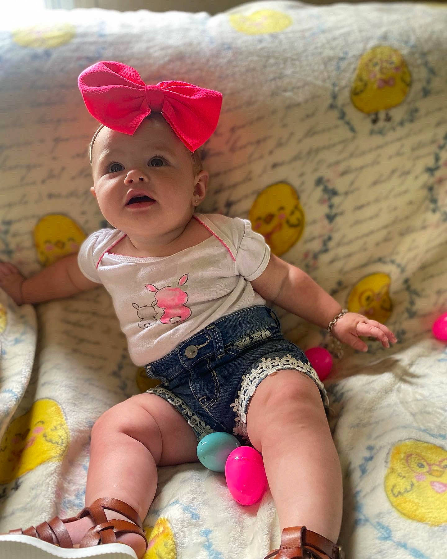 Preslee joined the competition — help win amazing prizes! baby, baby_toddler_clothing, child, fun, happy, headgear, headwear, leisure, pattern, person, pink, play, product, shoe, sitting, skin, sleeve, sock, t_shirt, textile