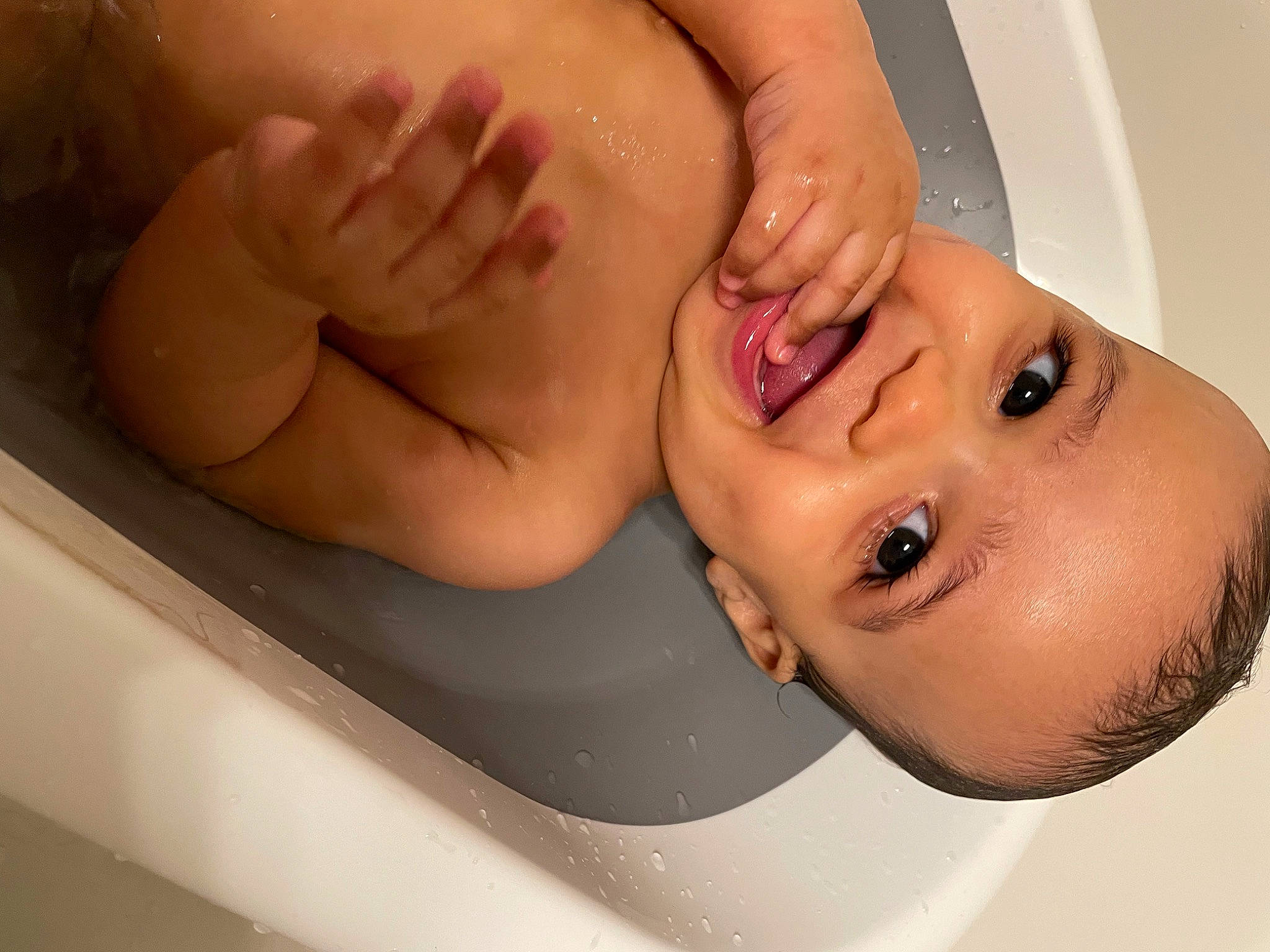 Alston is registered to the contest to win money with this photo: arm, bathtub, ear, eyelash, finger, gesture, happy, human_body, jaw, joint, leg, lip, mouth, muscle, nose, organ, person, skin, smile, stomach