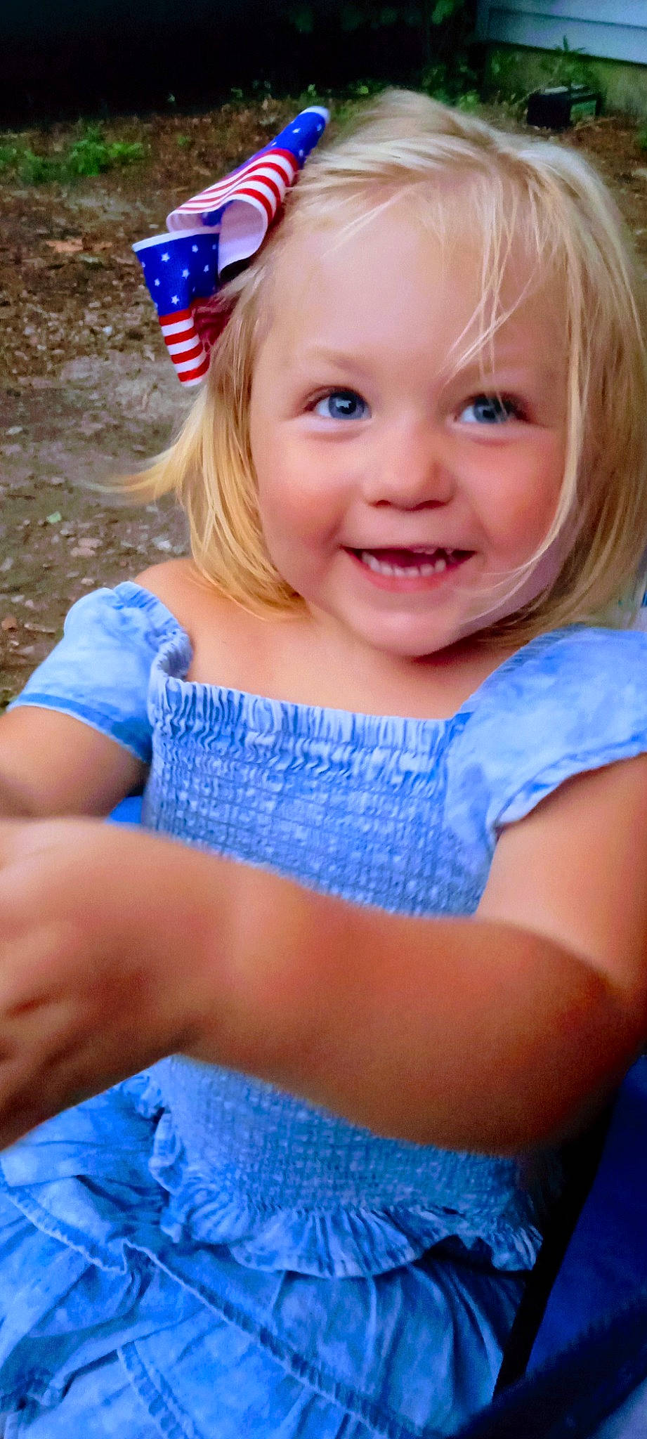 Annie is registered to the contest to win money with this photo: azure, baby_toddler_clothing, blond, blue, child, electric_blue, eye, facial_expression, fun, grass, happy, iris, joy, leisure, party_hat, person, pink, recreation, sitting, skin