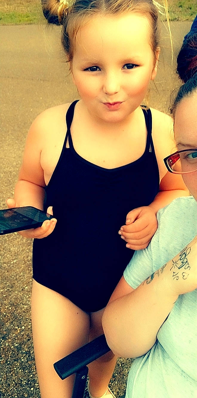 Carolyn is registered to the contest to win money with this photo: active_tank, arm, baby_toddler_clothing, blue, clothing, face, happy, head, joint, joy, leg, leotard, maillot, muscle, neck, one_piece_swimsuit, organ, person, shoulder, skin