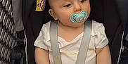 Samaël a rejoint le concours — aidez-le/la à gagner de superbes lots ! baby, pacifier, stroller, shopping_cart, child, infant, seatbelt, indoor, tiled_floor, person, cute, clothing, head, face, safety, young_child, shopping, retail, cart, curious