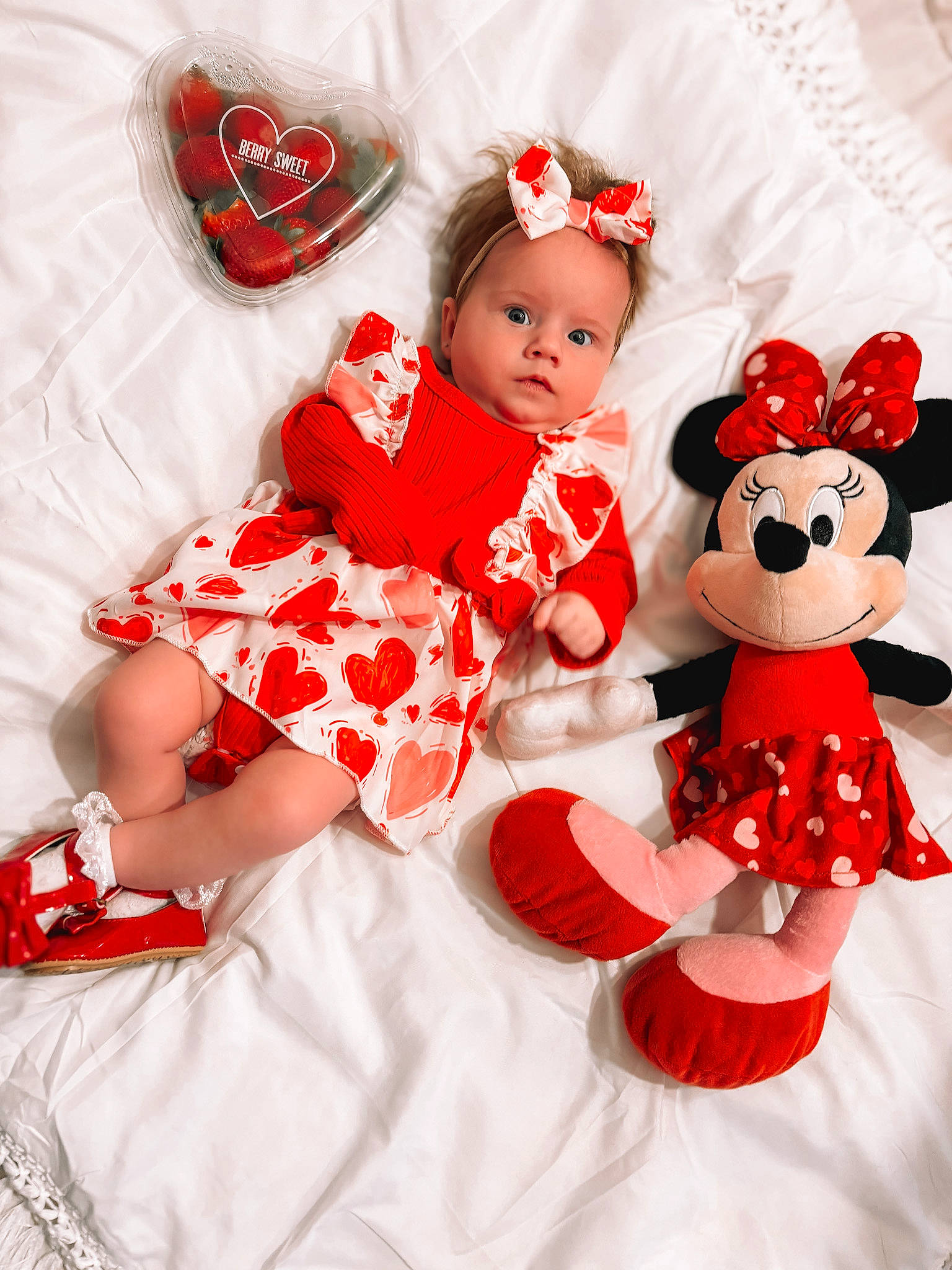 Oaklee is registered to the contest to win money with this photo: baby, baby_toddler_clothing, carmine, child, christmas, dress, event, fictional_character, happy, head, human_body, pattern, person, petal, pink, red, sleeve, sock, textile, toddler