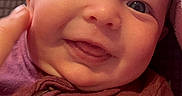 Sofia is registered to the contest to win money with this photo: baby, child, closeup, clothing, cozy, cute, expression, eyes, fabric, face, hand, happy, infant, joy, person, portrait, skin, smiling, texture, warm