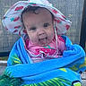 baby, child, towel, hat, strawberry, blue, pink, tongue, smiling, outdoor, chair, woven, cute, portrait, person, face, summer, playful, happy, wrapped