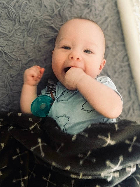 Harlen is registered to the contest to win money with this photo: baby, baby_toddler_clothing, cheek, comfort, eye, face, finger, flash_photography, gesture, hairstyle, happy, head, iris, lip, mouth, nose, person, skin, sleeve, textile