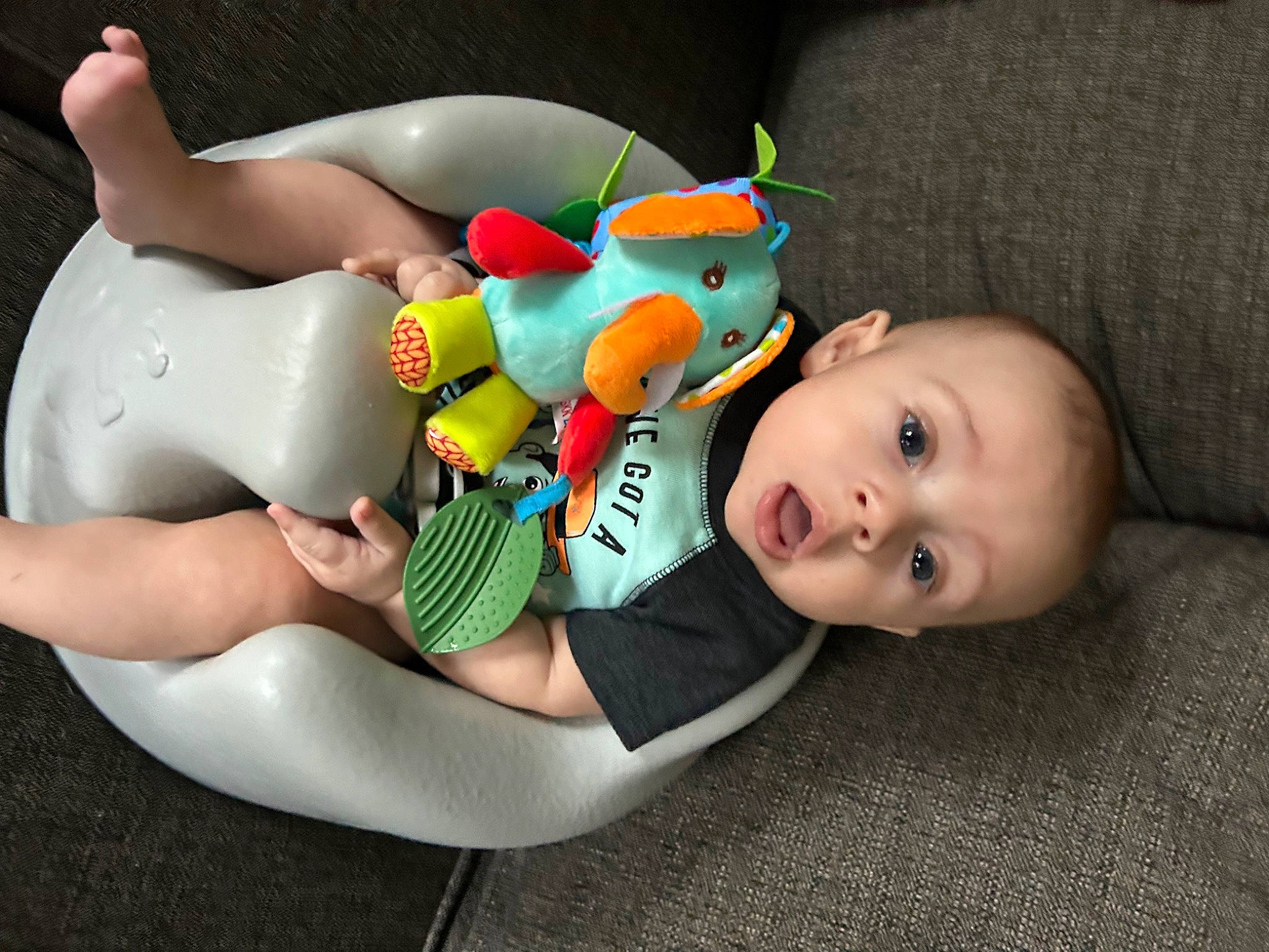 Dakota is registered to the contest to win money with this photo: arm, baby, baby_products, baby_safety, baby_toddler_clothing, baby_toys, child, comfort, flash_photography, fun, happy, human_leg, knee, leg, leisure, person, product, sitting, surprise, thigh