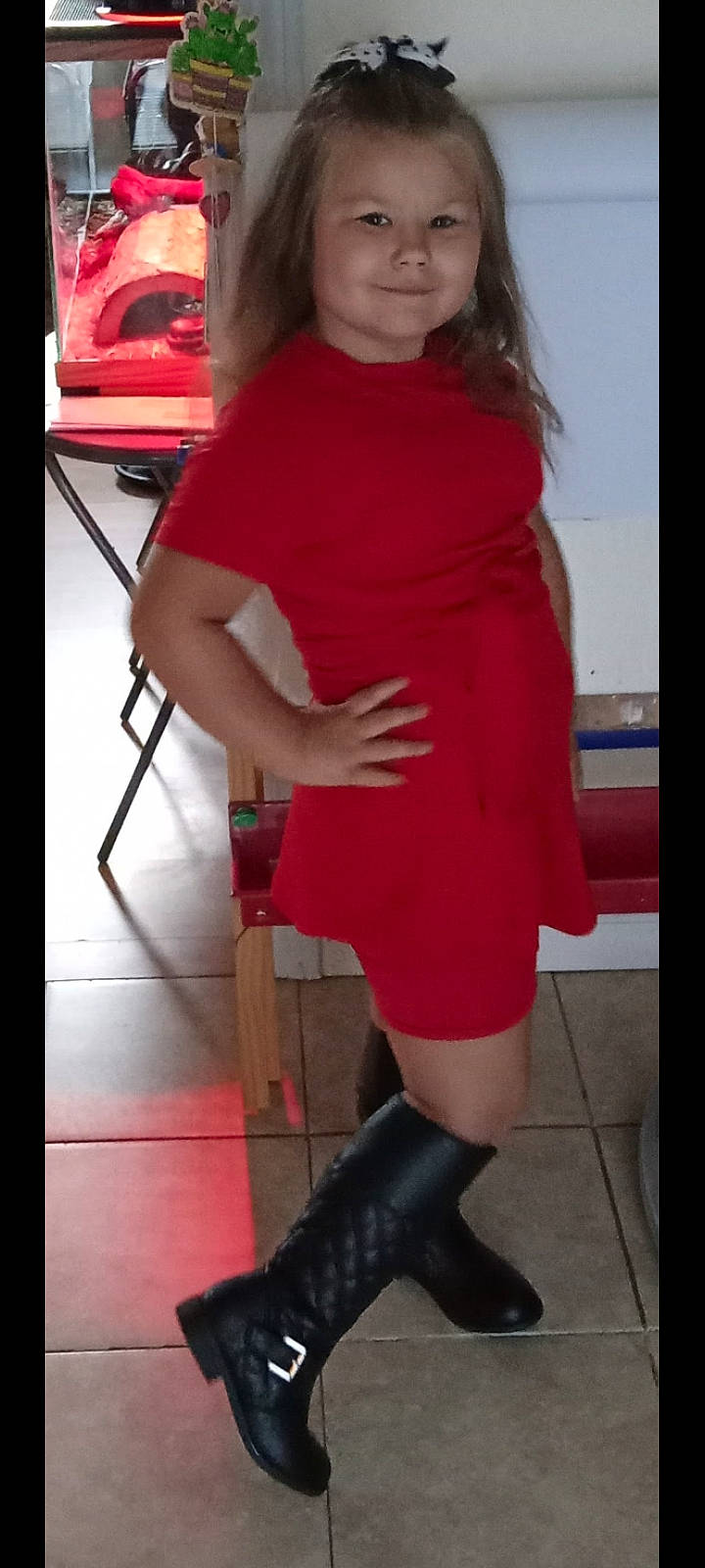 Tina Raelynne is registered to the contest to win money with this photo: calf, clothing, dress, electric_blue, fashion_design, flooring, human_leg, joint, joy, knee, knee_high_boot, leg, magenta, neck, person, red, riding_boot, shoe, sleeve, standing