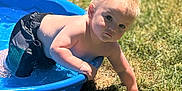 Ryker joined the competition — help win amazing prizes! child, toddler, pool, water, outdoor, grass, sunlight, blonde_hair, summer, swim_shorts, playing, daylight, curious, baby, skin, person, nature, recreation, fun, young
