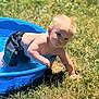 child, toddler, pool, water, outdoor, grass, sunlight, blonde_hair, summer, swim_shorts, playing, daylight, curious, baby, skin, person, nature, recreation, fun, young