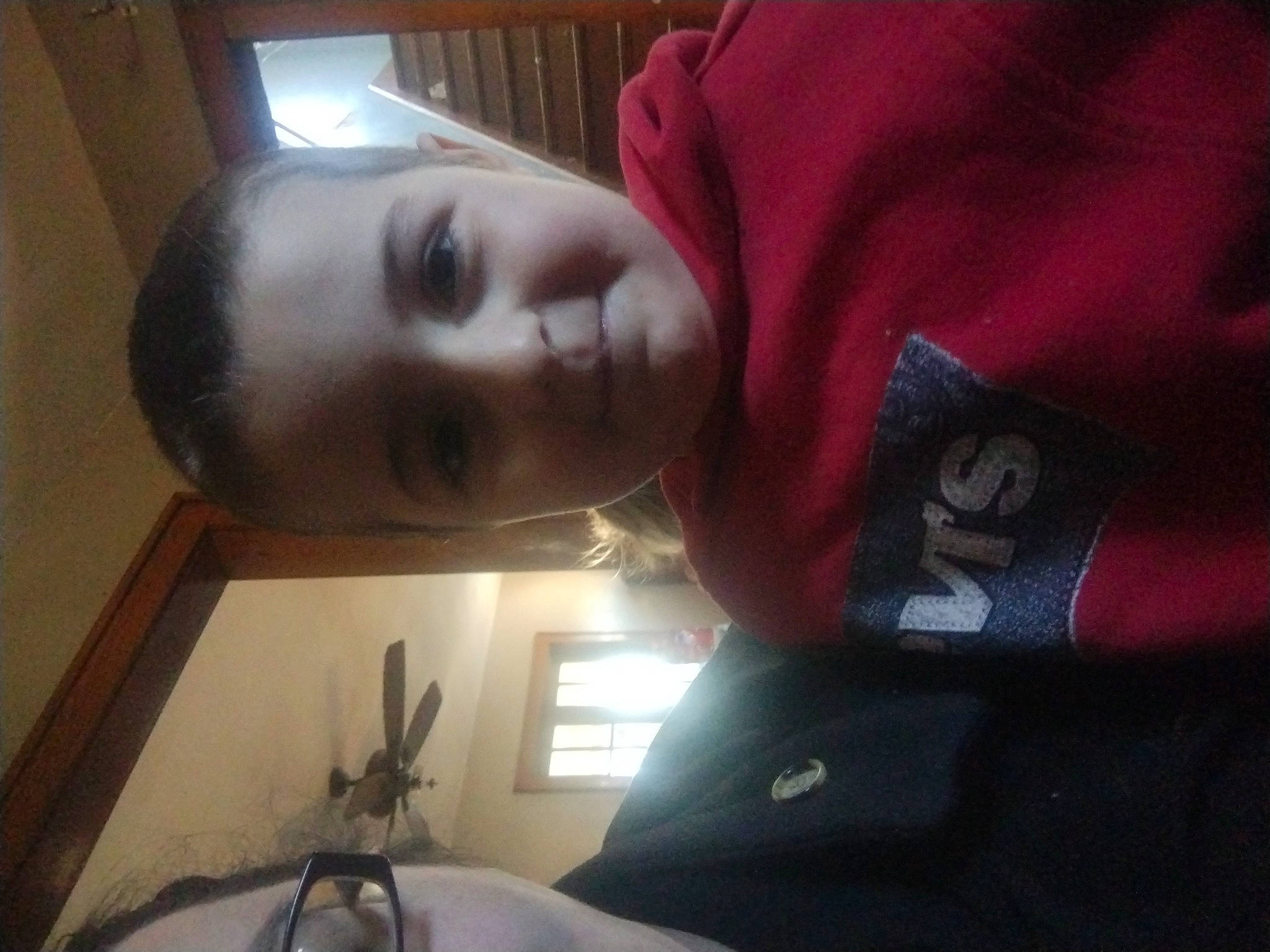 Rosie is registered to the contest to win money with this photo: carmine, child, comfort, flesh, fun, happy, joy, nose, person, room, sleeve, smile, t_shirt, toddler