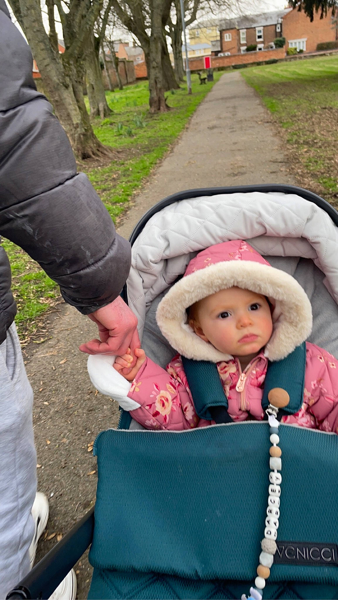Darcey is registered to the contest to win money with this photo: baby, baby_carriage, baby_products, baby_toddler_clothing, beanie, cap, child, eye, fashion_accessory, fun, grass, headwear, knit_cap, leisure, magenta, person, plant, recreation, sitting, toddler