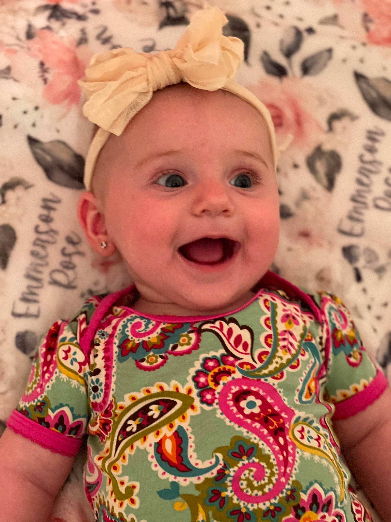 Emmerson is registered to the contest to win money with this photo: baby, baby_toddler_clothing, cheek, child, chin, dress, fun, happy, headgear, iris, lip, mammal, mouth, person, pink, skin, sleeve, smile, t_shirt, textile
