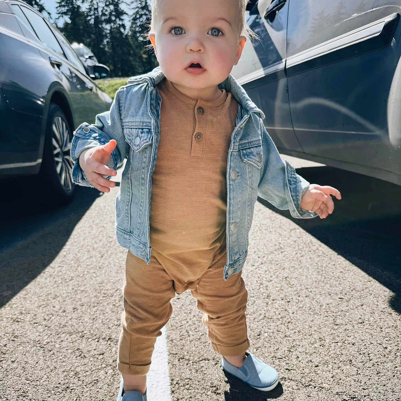 Luca joined the competition — help win amazing prizes! boy, child, clothing, coat, face, hair, head, jacket, jeans, machine, male, pants, person, sitting, sleeve, standing, tire, transportation, vehicle, wheel
