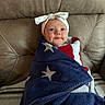 baby, infant, blanket, stars, headband, bow, leather_chair, cozy, wrapped, blue, red, white, cute, face, smile, indoor, portrait, child, young, seated