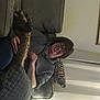 Calliecat is registered to the contest to win money with this photo: comfort, couch, elbow, eyewear, felidae, flooring, fun, fur, human_leg, knee, picture_frame, plaster, room, sitting, smile, thigh, wood