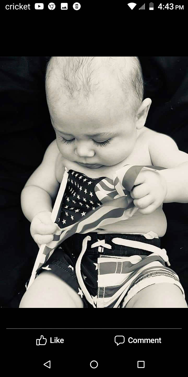 Esaiah is registered to the contest to win money with this photo: arm, baby, black, black_and_white, cheek, child, eye, finger, hand, monochrome, monochrome_photography, person, photograph, photography, portrait_photography, sitting, skin, smile, stock_photography, style