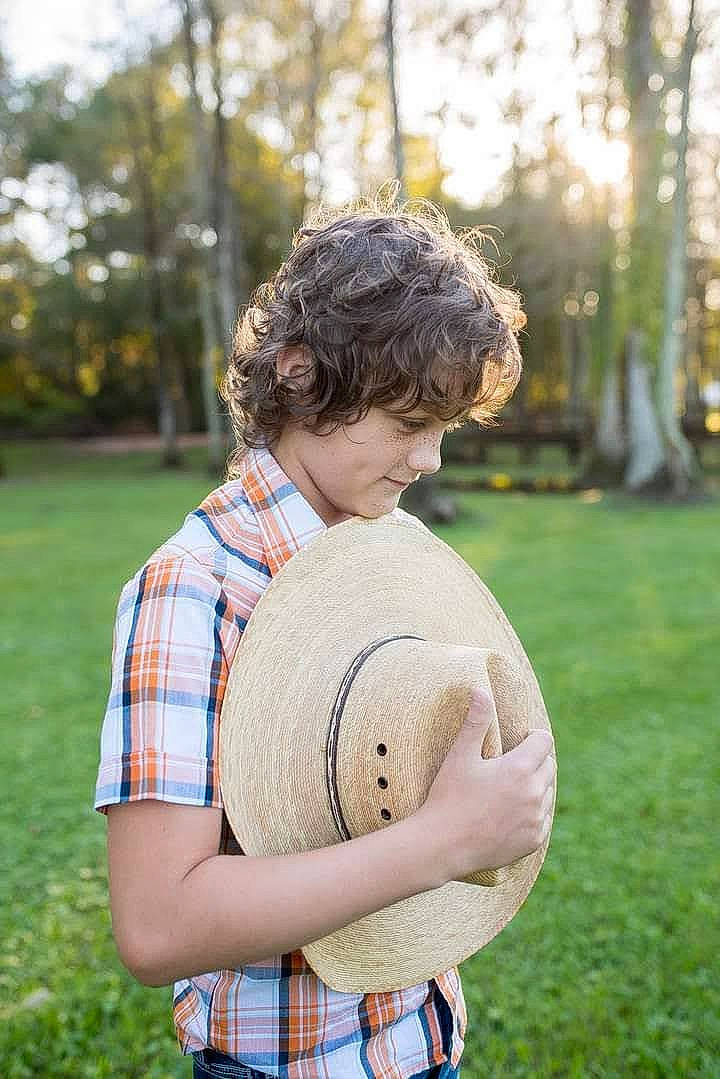 Brennan joined the competition — help win amazing prizes! arm, ball, fun, grass, hand, happy, leisure, pattern, people, people_in_nature, person, plaid, plant, recreation, shirt, sports_equipment, standing, summer, t_shirt, tartan