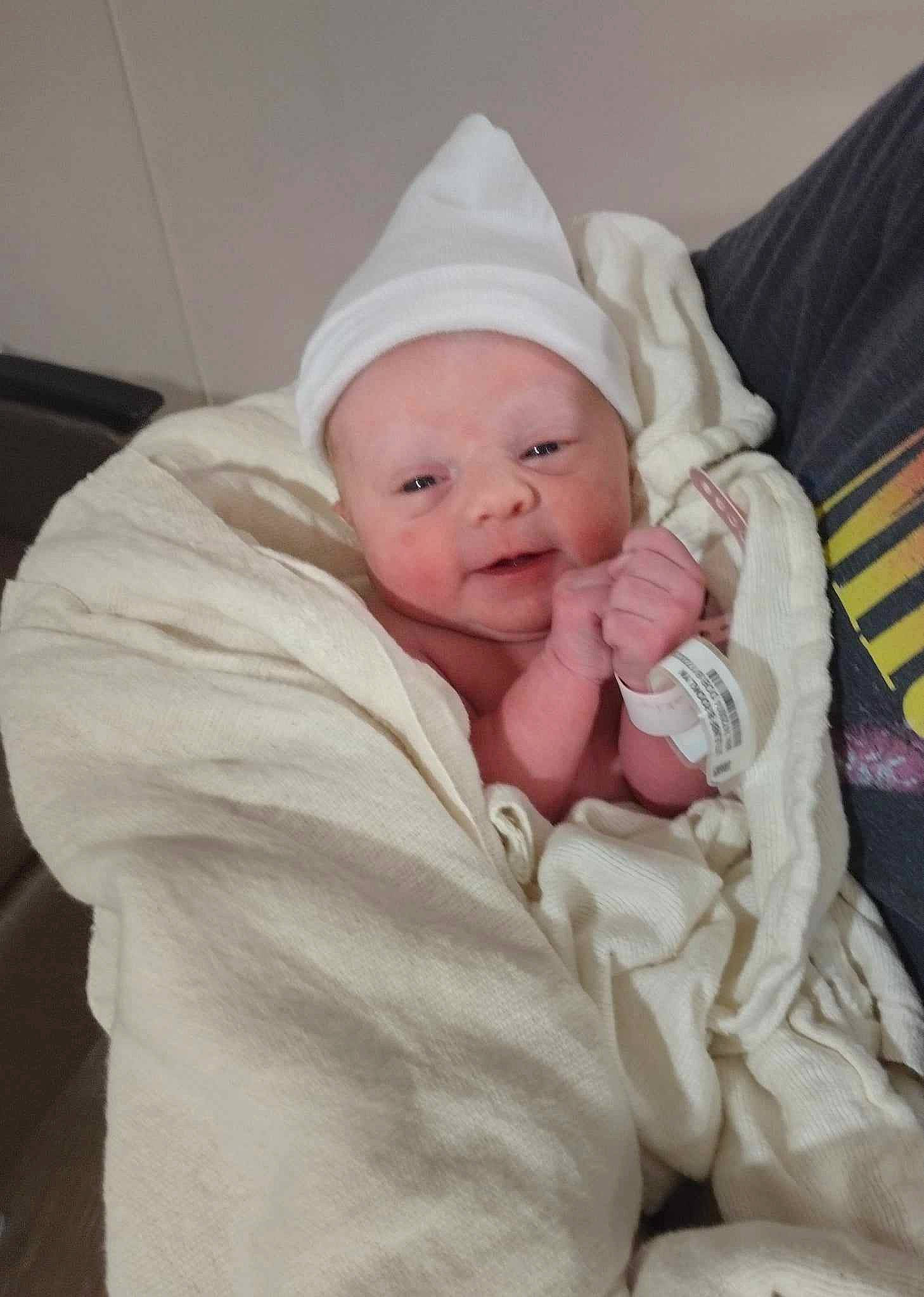 Fiona joined the competition — help win amazing prizes! baby, baby_products, baby_sleeping, baby_toddler_clothing, beanie, cap, cheek, child, comfort, eye, face, happy, hat, head, linens, person, room, sitting, sleeve, smile