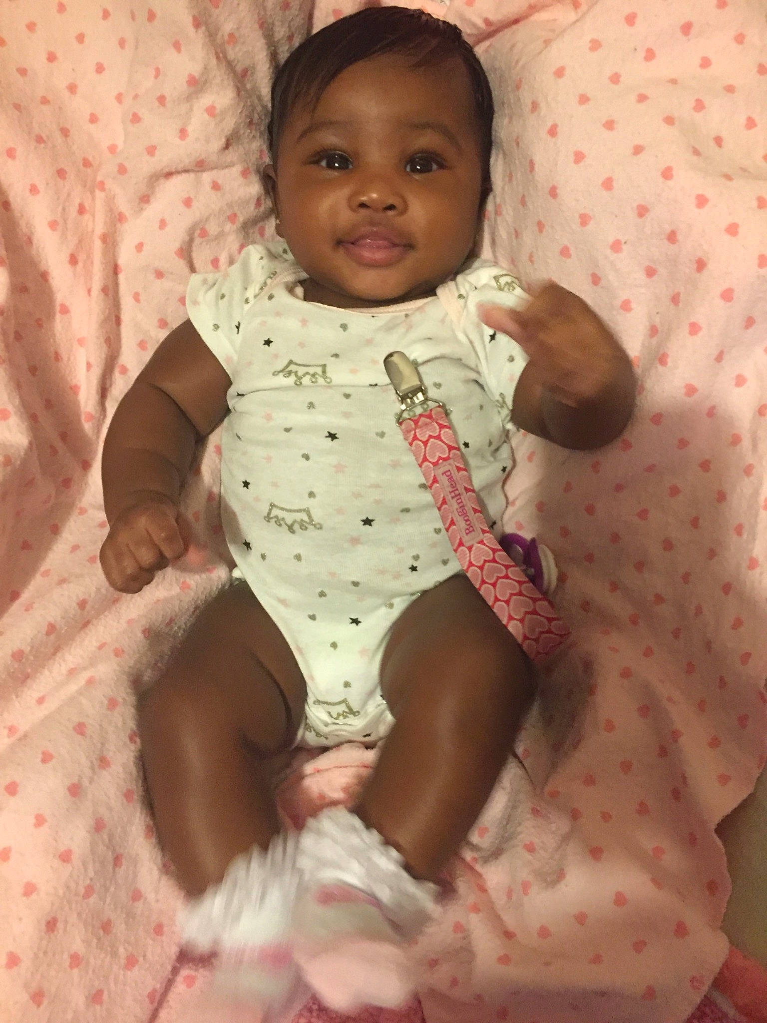 Kaliyah is registered to the contest to win money with this photo: baby, baby_toddler_clothing, cheek, child, person, pink, sitting, skin, smile, toddler