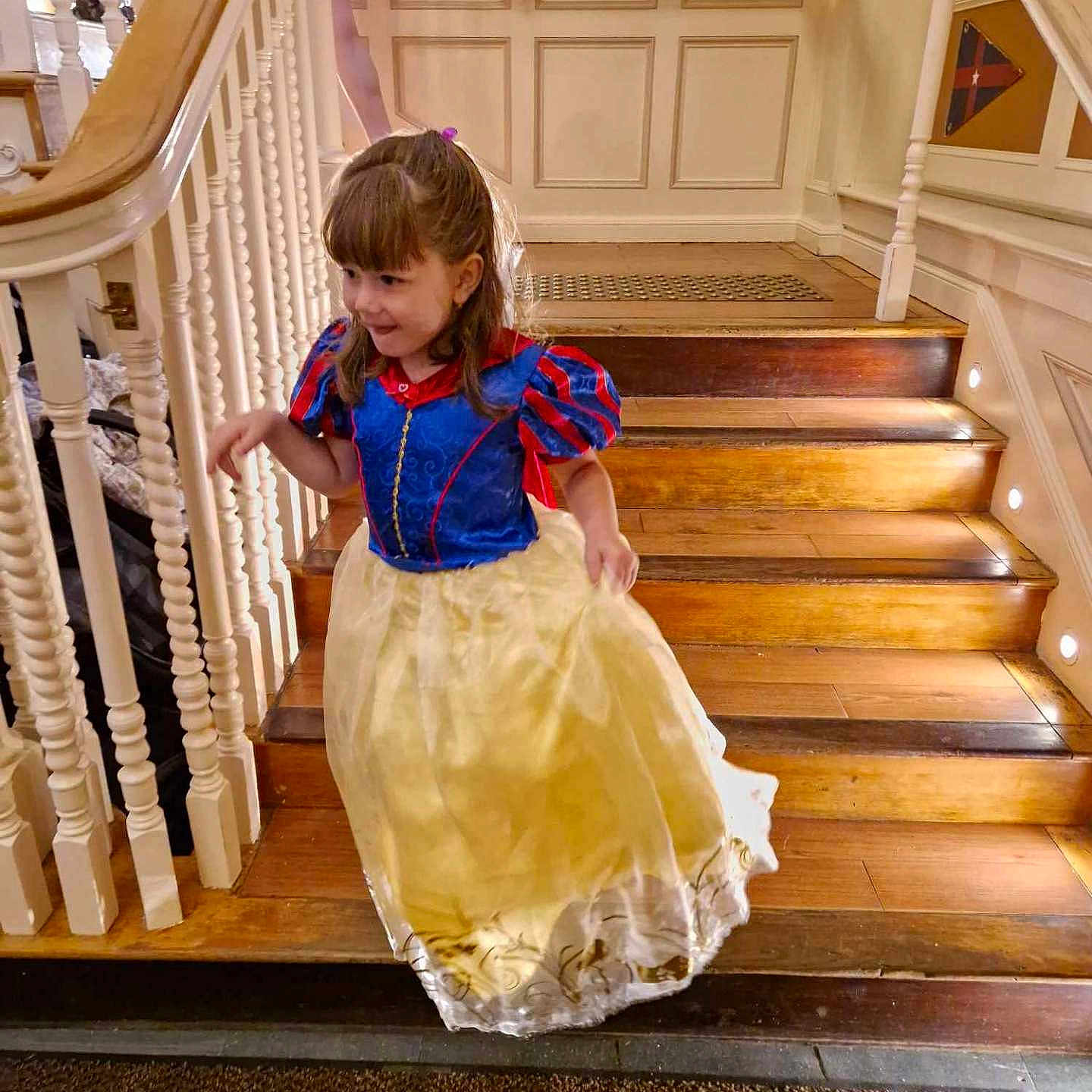 Louvana participe au concours pour gagner de l'argent avec cette photo : architecture, building, child, clothing, dress, face, female, foyer, girl, handrail, hardwood, house, housing, indoors, interiordesign, person, sitting, stainedwood, staircase, wood