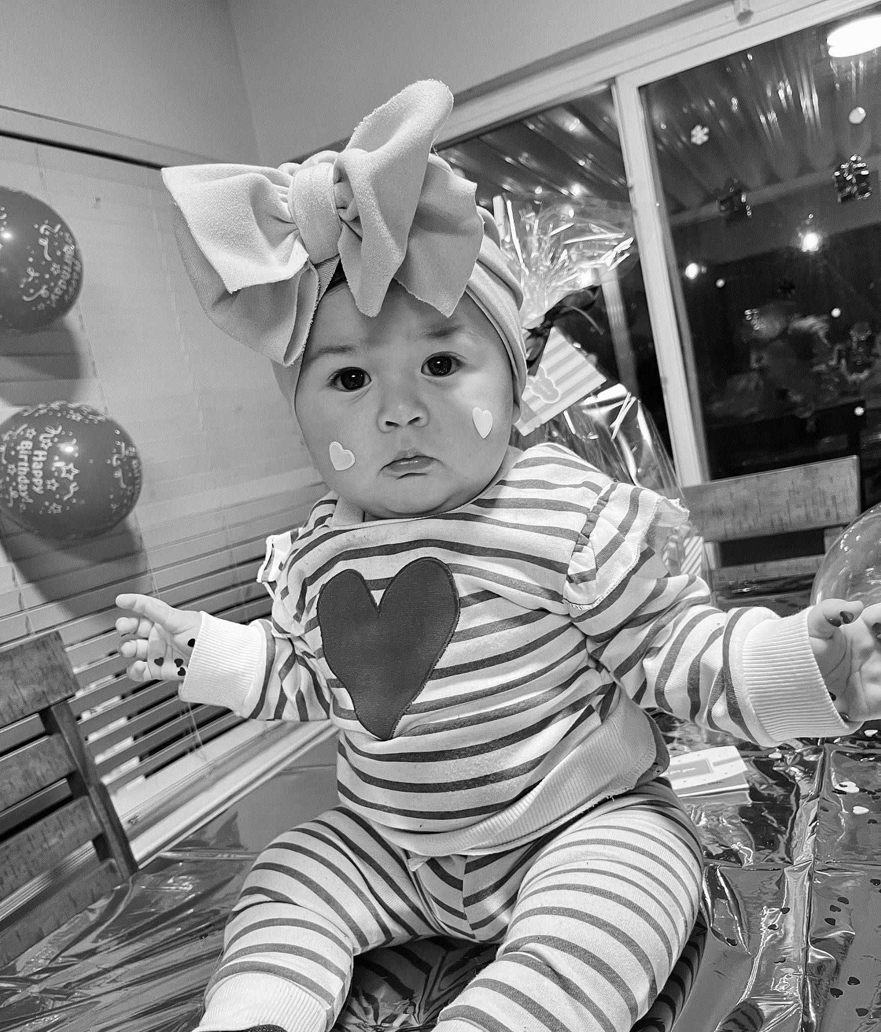 Arya is registered to the contest to win money with this photo: baby, baby_toddler_clothing, black, black_and_white, child, city, fun, happy, hat, headwear, monochrome, monochrome_photography, pattern, person, room, sitting, standing, stock_photography, street, style