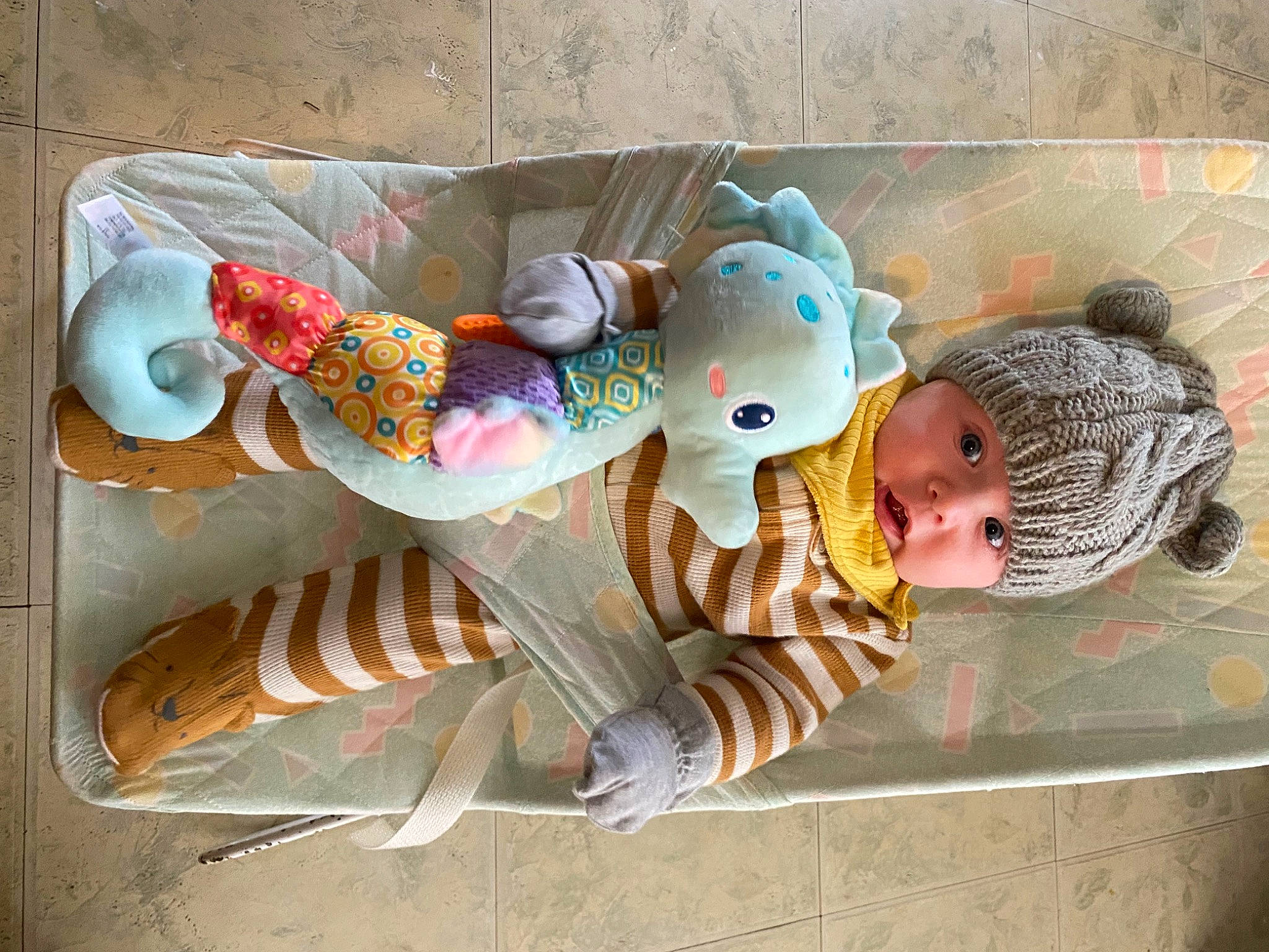 Remington is registered to the contest to win money with this photo: art, baby, baby_products, baby_toddler_clothing, baby_toys, child, comfort, head, headwear, linens, person, room, textile, toddler, visual_arts