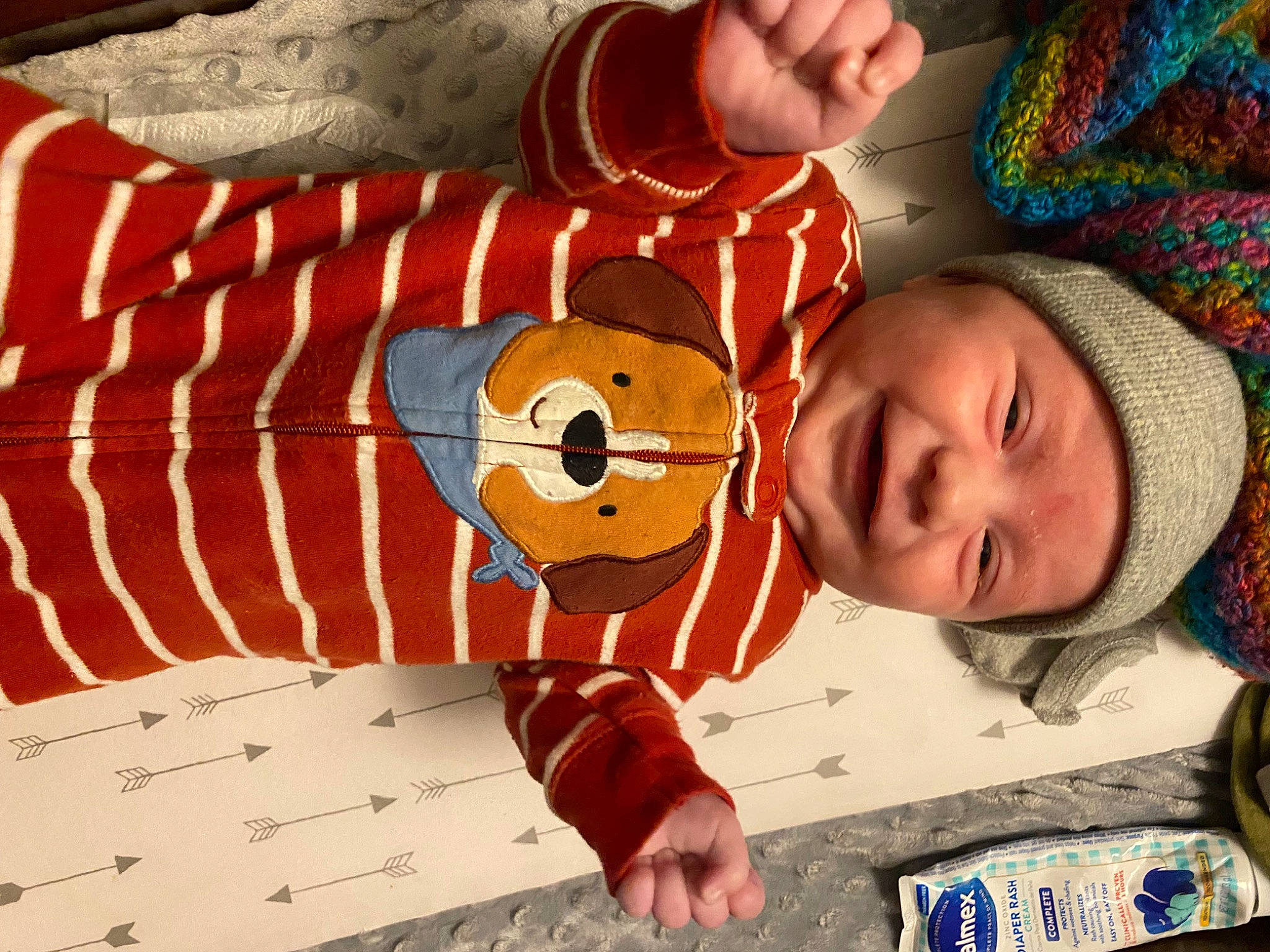 Remington is registered to the contest to win money with this photo: art, baby, child, comfort, elbow, event, finger, fun, gesture, happy, headwear, linens, orange, pattern, person, room, textile, thumb, toddler, wood