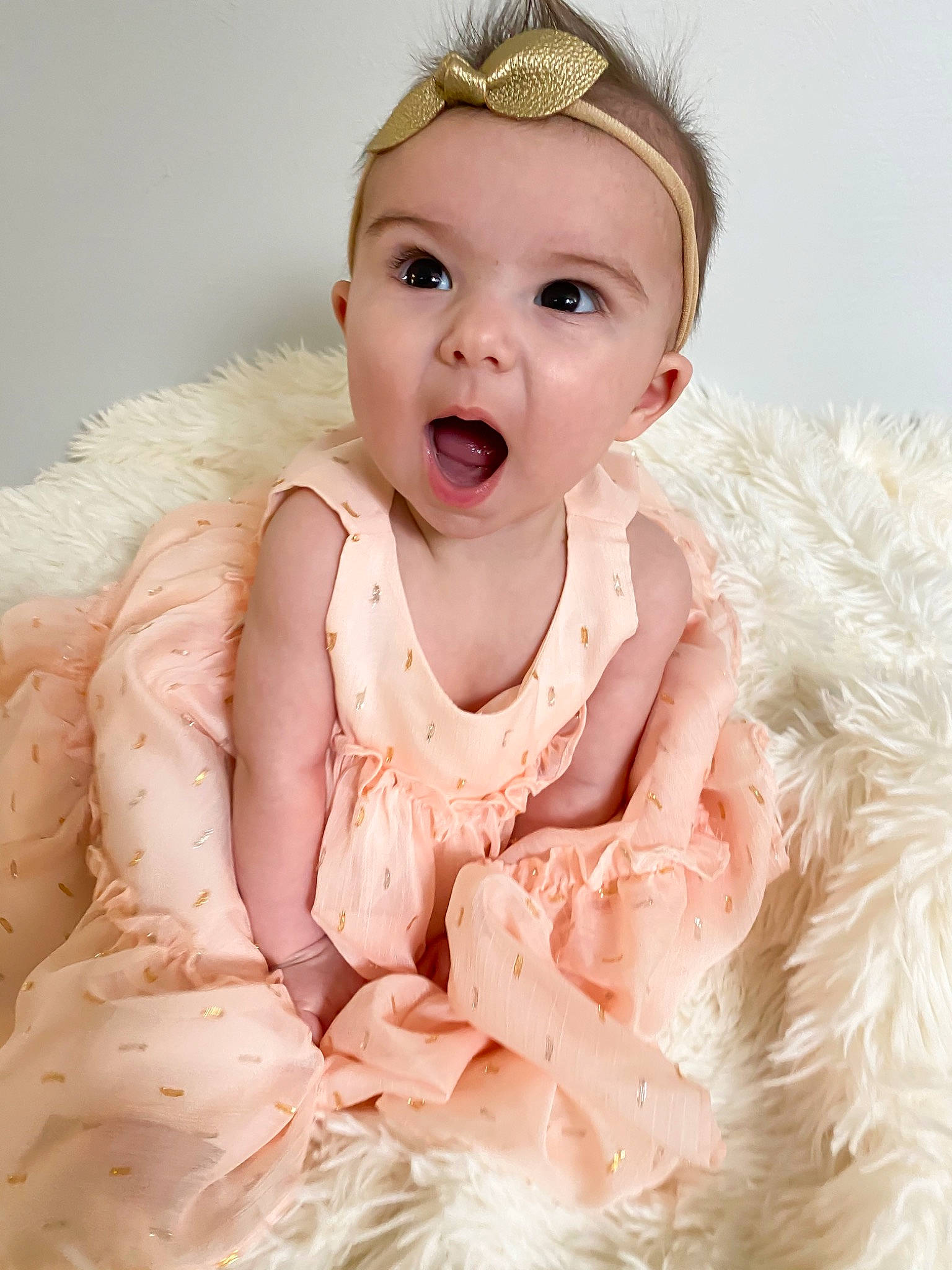 Mazey joined the competition — help win amazing prizes! baby, baby_toddler_clothing, cheek, child, child_model, clothing, costume, dress, face, fashion_accessory, fur, hair_accessory, head, iris, lip, person, pink, skin, smile, surprise
