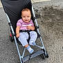 baby, casual, child, clothing, comfort, cute, daylight, happy, infant, leisure, outdoor, pavement, person, seat, smiling, socks, stroller, transport, wheels, young