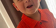 Ilyan a rejoint le concours — aidez-le/la à gagner de superbes lots ! boy, buttoned_shirt, child, clothing, curtains, cute, eyes, face, floor, happy, indoor, light, orange_shirt, person, portrait, short_hair, skin, smiling, toddler, window