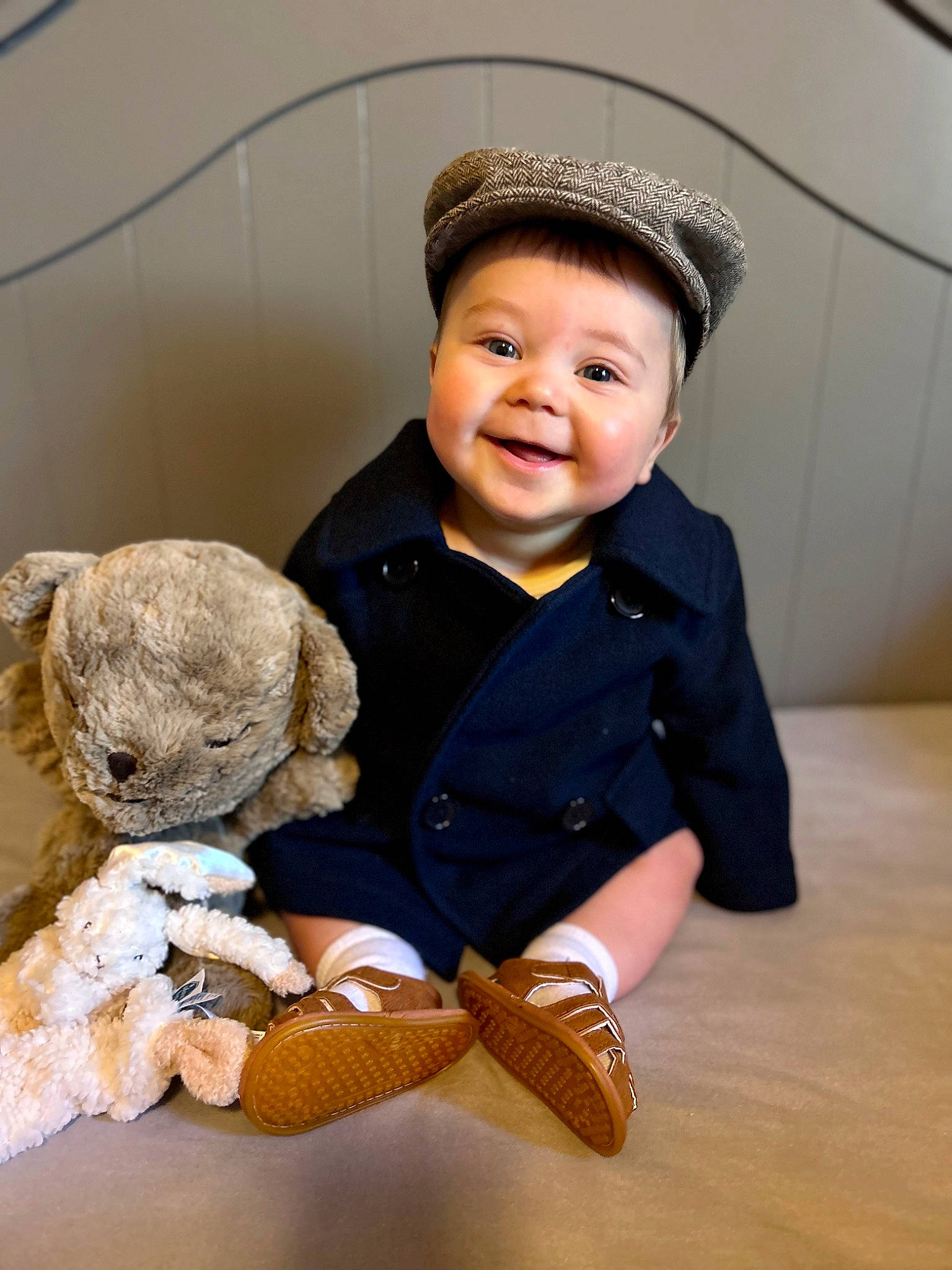 Dom is registered to the contest to win money with this photo: baby, baby_toddler_clothing, cap, child, flash_photography, flooring, fur, happy, hardwood, hat, joy, person, plush, sitting, skin, sleeve, smile, stuffed_toy, teddy_bear, toddler