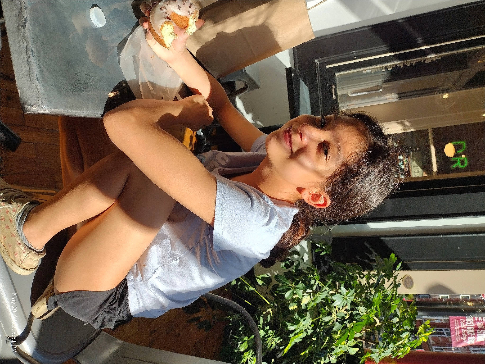 Dani is registered to the contest to win money with this photo: abdomen, black_hair, chest, eyewear, fun, gesture, hairstyle, happy, human_leg, joy, knee, leisure, long_hair, luggage_and_bags, mouth, person, photograph, sandal, shorts, smile