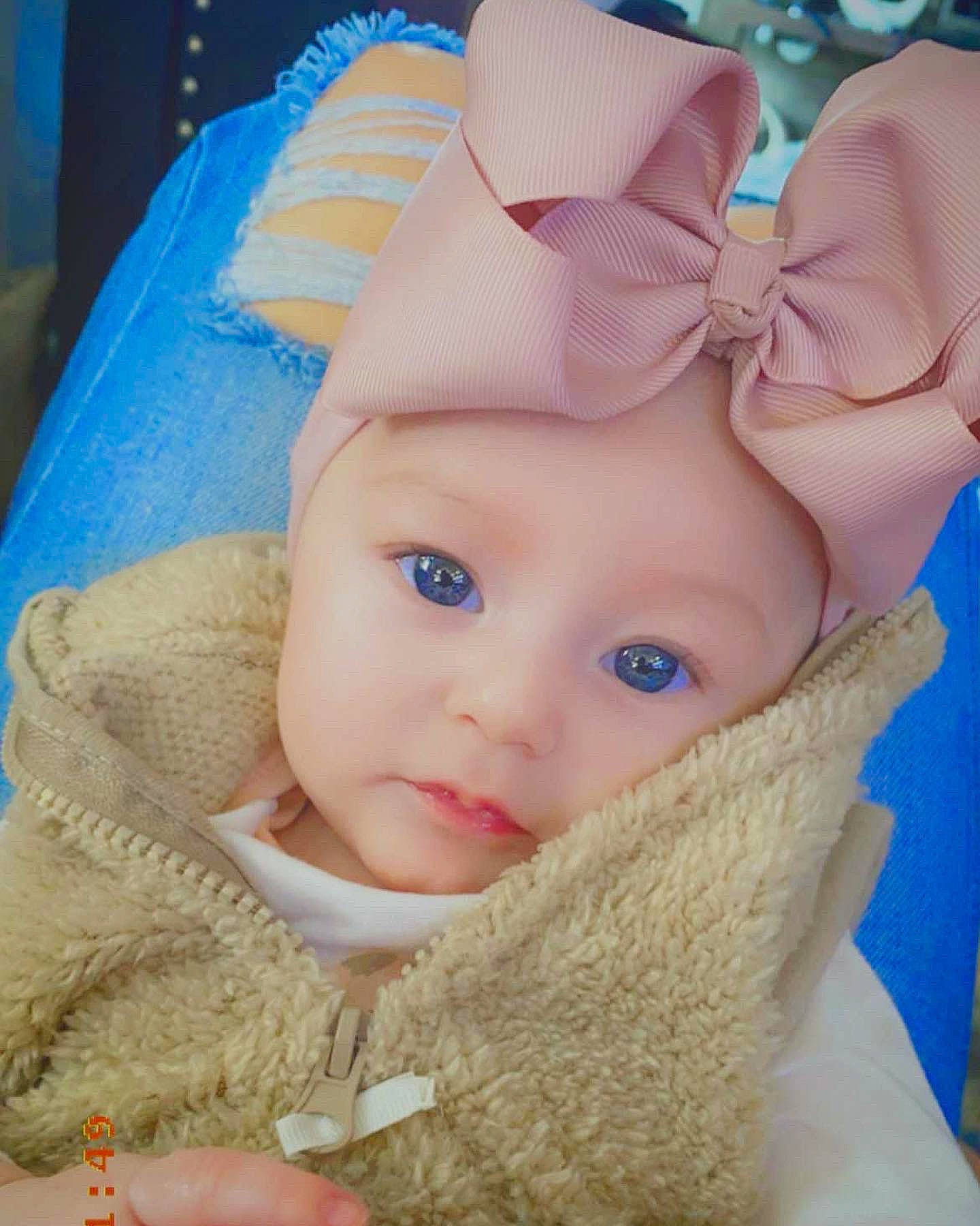 Leia is registered to the contest to win money with this photo: baby, baby_sleeping, baby_toddler_clothing, cap, comfort, eye, eyelash, headwear, human_body, iris, knit_cap, lip, nose, organ, outerwear, person, pink, product, skin, sleeve