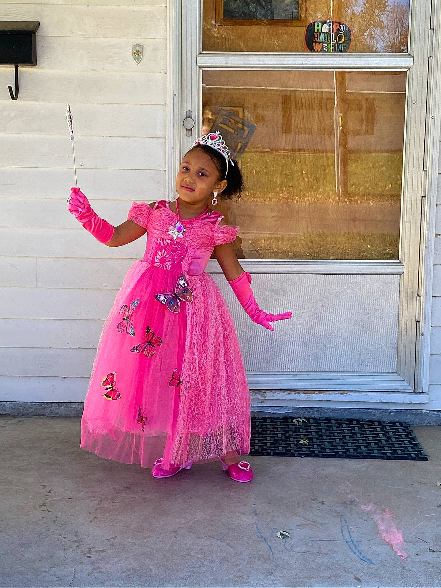 Asia is registered to the contest to win money with this photo: baby_toddler_clothing, child_model, costume, costume_accessory, day_dress, door, dress, embellishment, fashion_accessory, fixture, floor, hair_accessory, headgear, home_door, joy, magenta, one_piece_garment, person, pink, toddler