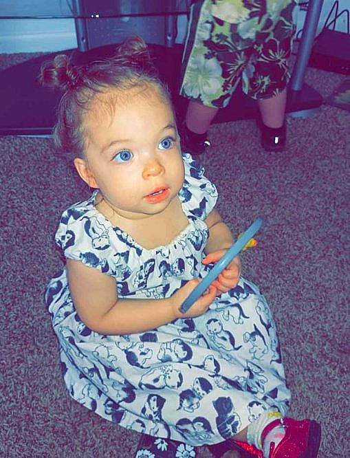 Jasmine is registered to the contest to win money with this photo: baby_toddler_clothing, child, dress, electric_blue, event, fashion_design, floor, flooring, fun, hair, happy, human_leg, iris, magenta, pattern, people, person, pink, purple, sitting