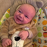 Morgan is registered to the contest to win money with this photo: baby, baby_fashion, baby_seat, bear_costume, cartoon, child, clothing, colorful, cozy, cute, fuzzy, happy, indoor, infancy, infant, onesie, patterned, portrait, smiling, toy_pattern