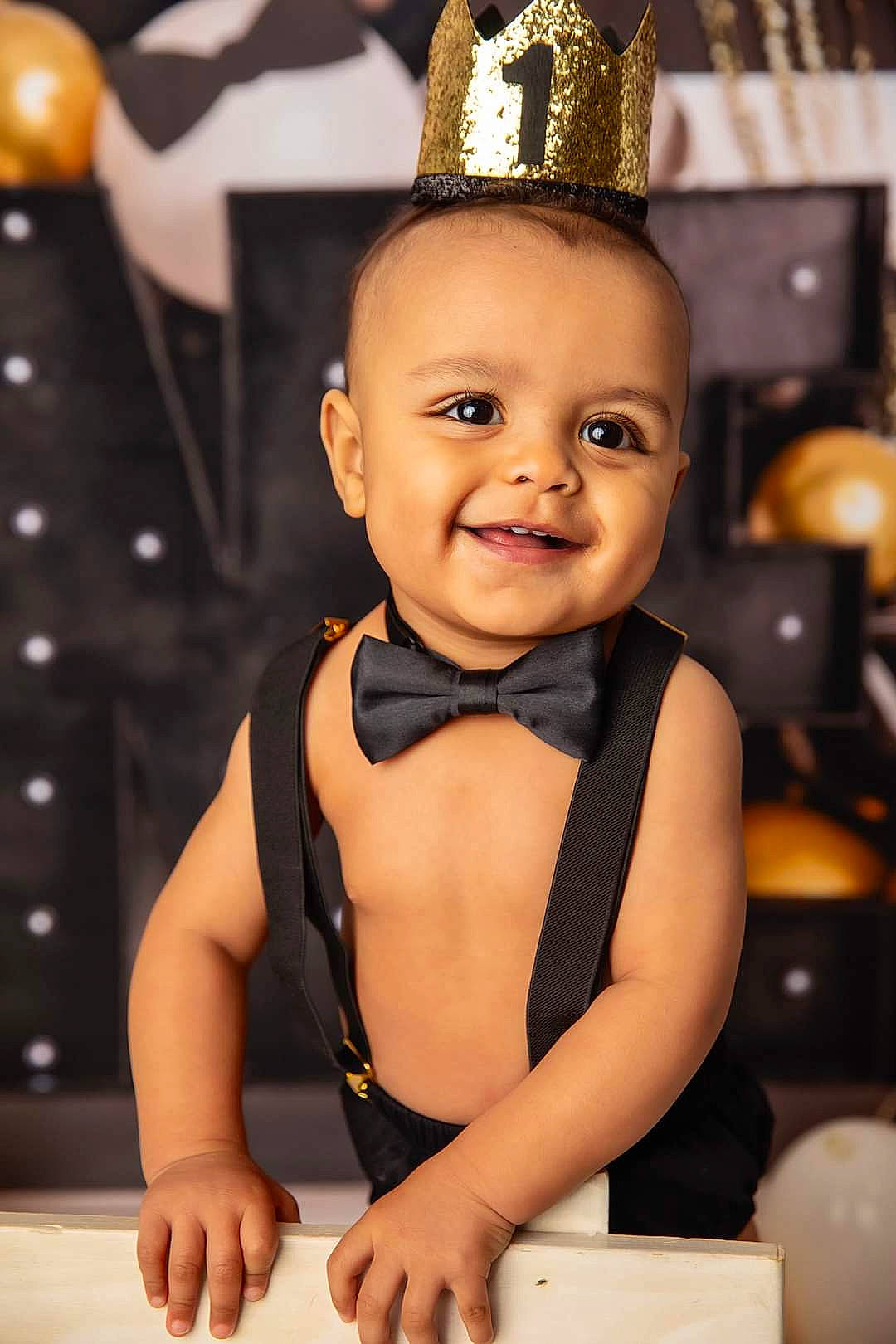 King joined the competition — help win amazing prizes! baby, baby_toddler_clothing, cheek, child, costume_hat, event, fashion_accessory, happy, hat, holiday, jewellery, joy, ornament, party_hat, person, sitting, skin, smile, thumb, tie