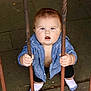 Carter joined the competition — help win amazing prizes! baby, child, iron_bars, blue_shirt, black_pants, white_socks, curious, outdoor, stone_pavement, holding, grip, standing, rusty, metal, expression, face, person, young_child, casual_clothing, daylight