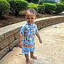 Amarion joined the competition — help win amazing prizes! toddler, child, barefoot, smiling, outdoor, concrete, stone_wall, bushes, greenery, sunny, shorts, shirt, happy, person, daylight, curved_wall, nature, casual_clothing, playful, summer