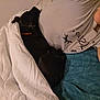 Aria participe au concours pour gagner de l'argent avec cette photo : dog, blanket, person, bed, sleeping, indoor, cozy, black_dog, resting, comfort, casual, tshirt, tattoo, collar, fabric, human, face_partial, pillow, relaxation, warm