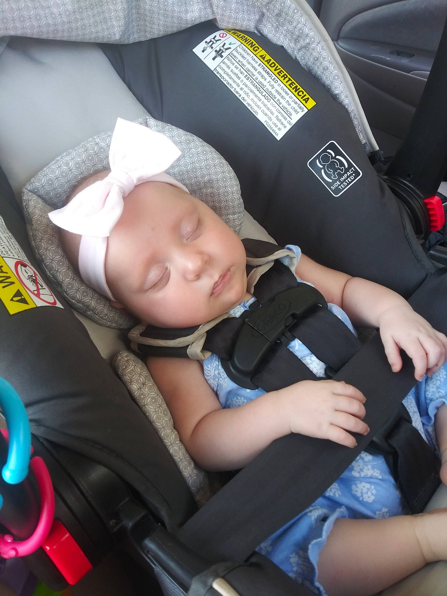 Annika is registered to the contest to win money with this photo: auto_part, baby, baby_carriage, baby_in_car_seat, baby_products, car_seat, car_seat_cover, child, person, product, seat_belt, toddler