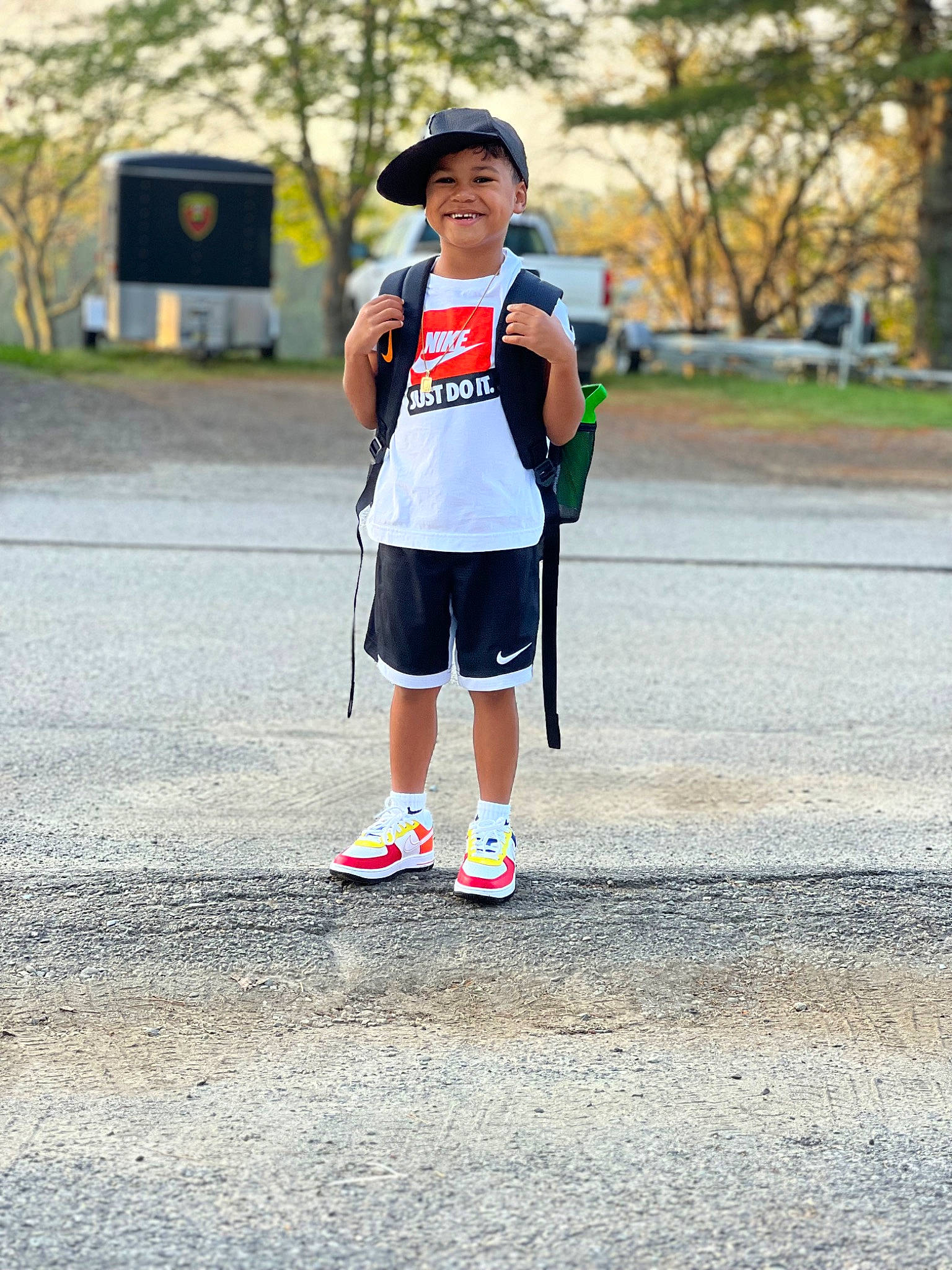 Jason is registered to the contest to win money with this photo: asphalt, athlete, clothing, electric_blue, endurance_sports, exercise, footwear, hat, headwear, human_leg, joy, knee, leisure, person, plant, player, running, shorts, sneakers, sports_equipment