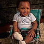 Rocket joined the competition — help win amazing prizes! baby, carpet, chair, child, cute, expression, face, footwear, furniture, hand, happy, indoor, infant, onesie, person, room, seatbelt, sitting, smile, sock