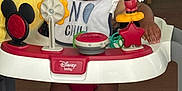 Rocket joined the competition — help win amazing prizes! baby, bib, child, clothing, disney, door, face, feet, floor, furniture, happy, indoor, mickey_mouse, person, playtime, smiling, socks, toy, walker, wooden_floor