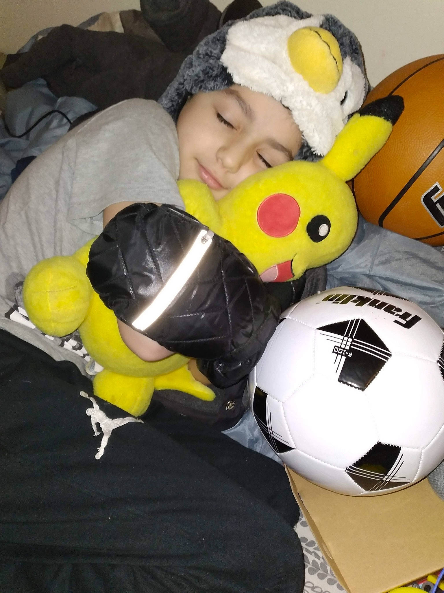 John joined the competition — help win amazing prizes! baby, ball, child, comfort, football, fun, green, happy, headwear, person, personal_protective_equipment, recreation, soccer, soccer_ball, sports_equipment, sports_gear, sports_toy, toddler, toy, white