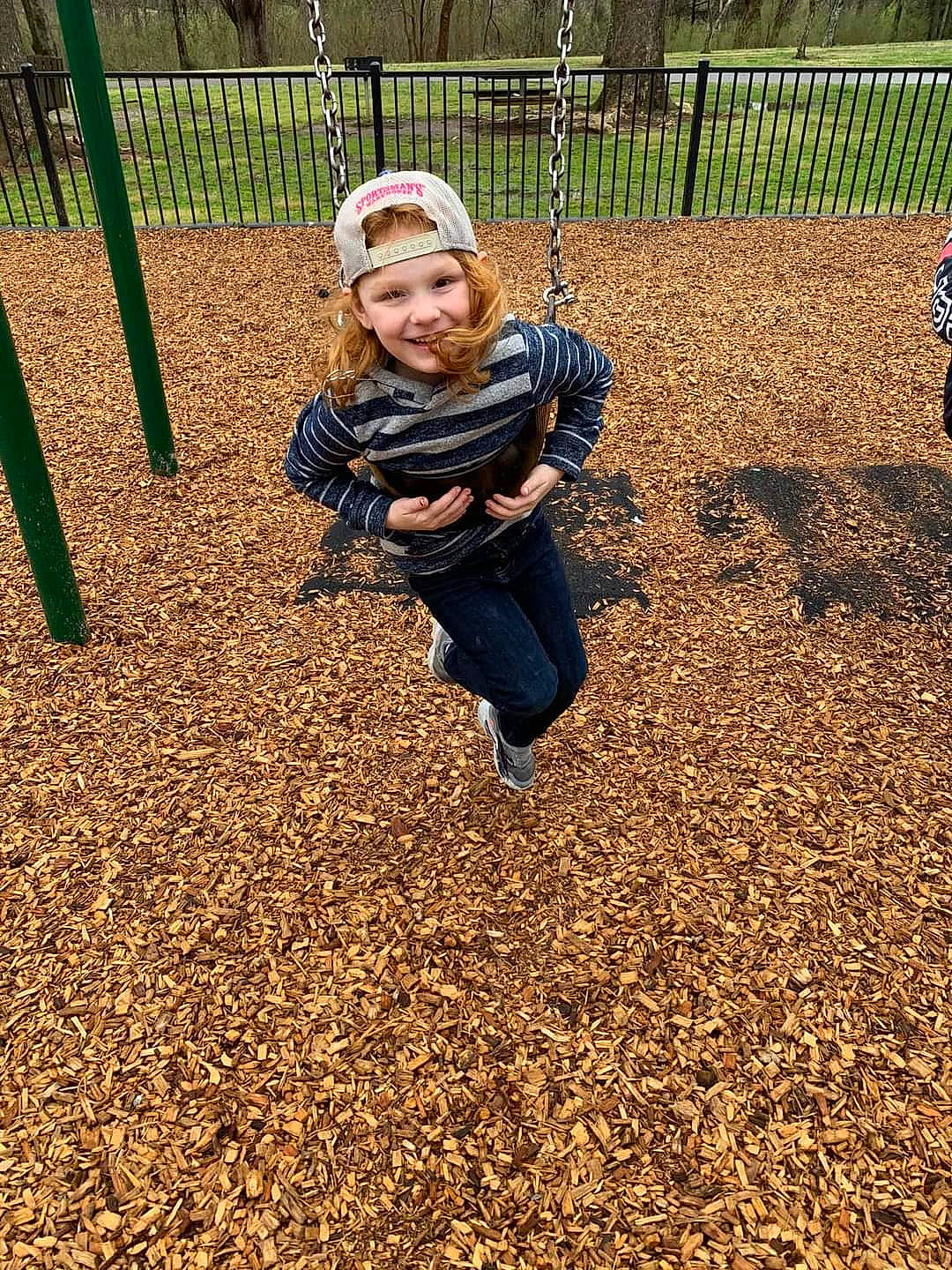 Jasmine is registered to the contest to win money with this photo: baby, bench, child, city, fun, grass, happy, headwear, joy, leaf, leisure, outdoor_play_equipment, people_in_nature, person, plant, playground, recreation, smile, soil, swing