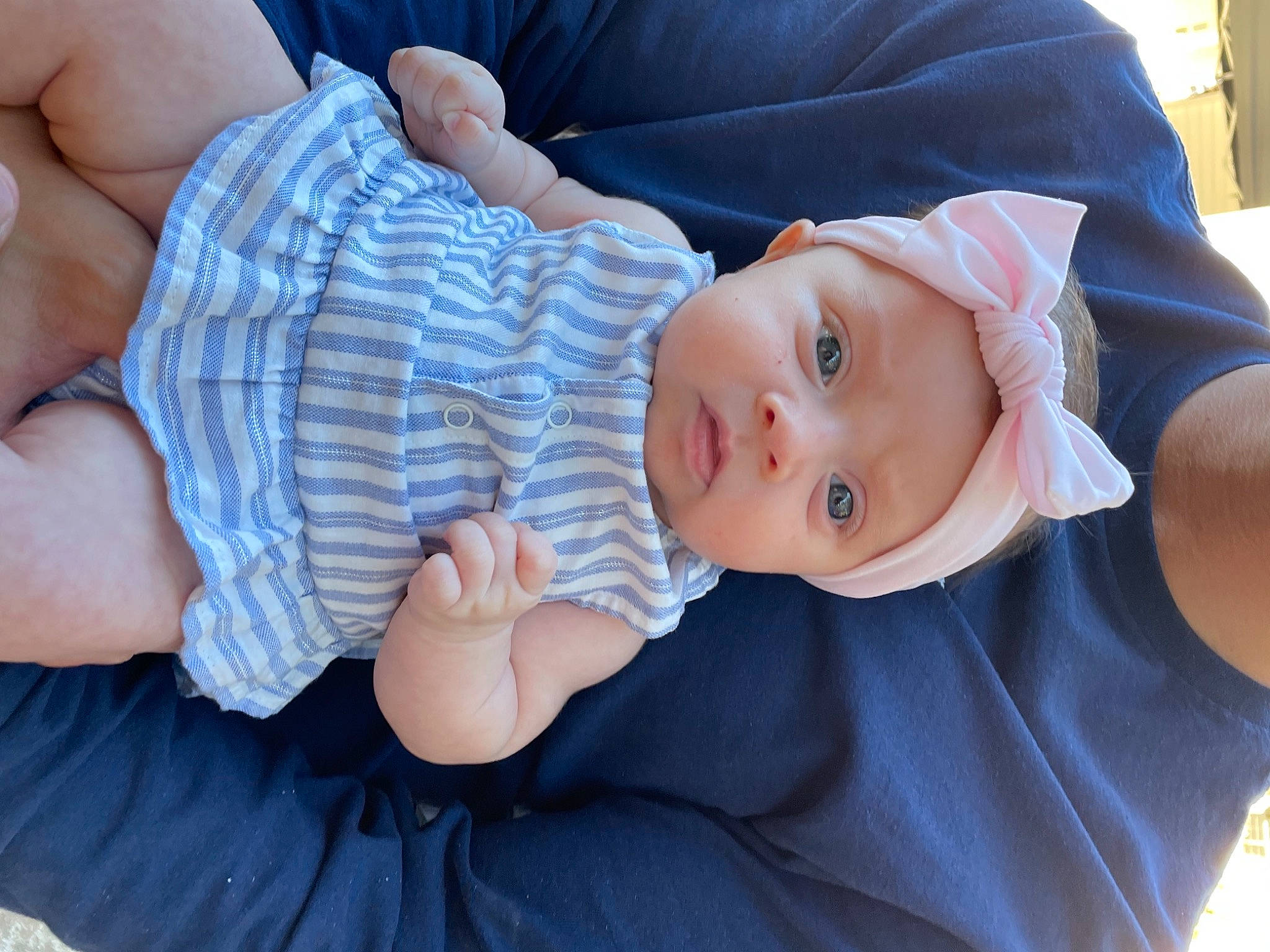 Finley is registered to the contest to win money with this photo: azure, baby, baby_products, baby_toddler_clothing, cheek, child, comfort, electric_blue, finger, hand, hat, headwear, iris, lip, pattern, people, person, sitting, skin, sleeve